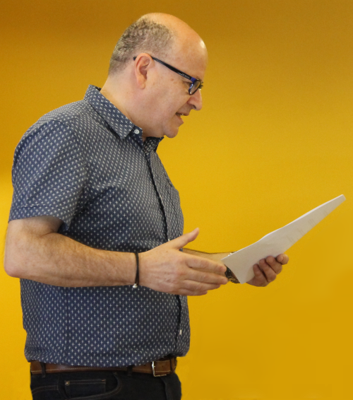 Ian Mayer speaking, reading from his notes
